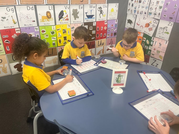 Students engaged in group work, engaged in their learning in one of our positive learning environments within all classrooms.