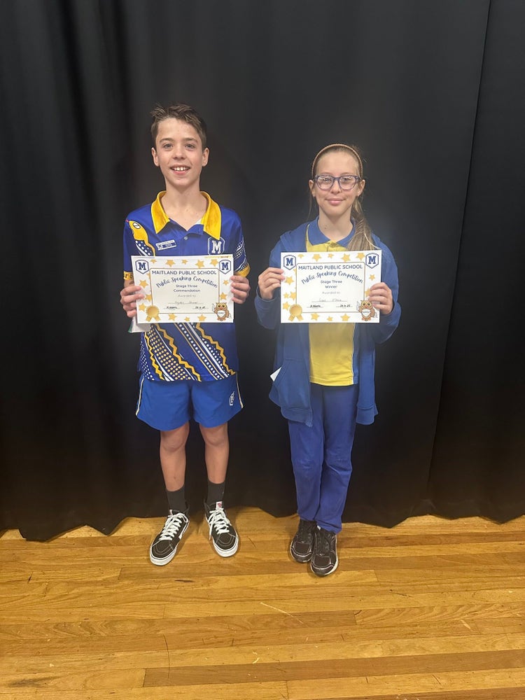 Two students who were finalists from Stage 3 in the whole school Public Speaking Competition, standing proudly with their certificates.